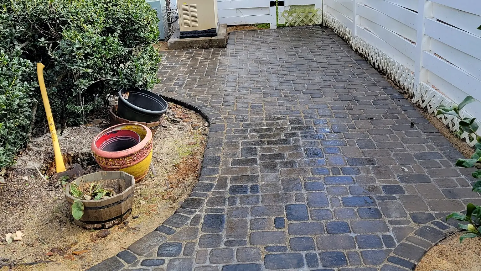 One of Guillermo’s jobs: Cobblestone side yard